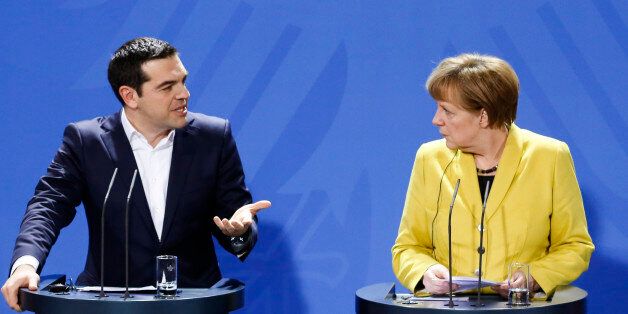 German Chancellor Angela Merkel, right, and the Prime Minister of Greece Alexis Tsipras brief the media during a bilateral meeting at the chancellery in Berlin, Monday, March 23, 2015. (AP Photo/Markus Schreiber)