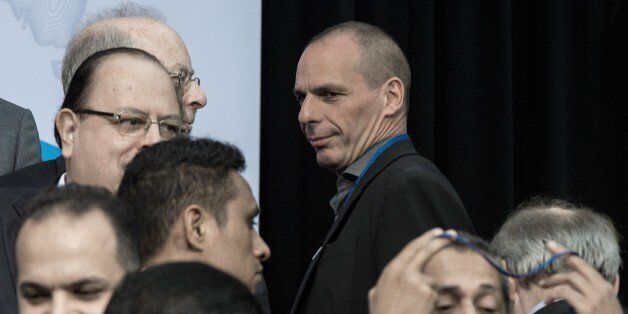 Greek Finance Minister Yanis Varoufakis arrives to pose for the International Monetary and Financial Committee (IMFC) family photo at the IMF/WB Spring Meetings in Washington, DC, on April 18, 2015. AFP PHOTO/NICHOLAS KAMM (Photo credit should read NICHOLAS KAMM/AFP/Getty Images)