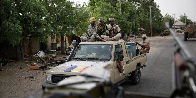 Chadian soldiers ride on trucks and pickups in the city of Damasak, Nigeria, Wednesday, March 18, 2015. Damasak was flushed of Boko Haram militants last week, and is now controlled by a joint Chadian and Nigerien force. (AP Photo/Jerome Delay)