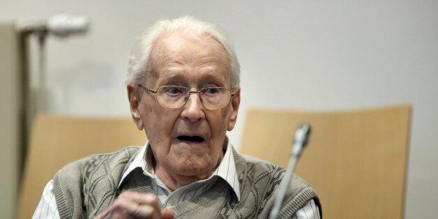 Former Nazi death camp officer Oskar Groening waits for the opening of his trial on April 21, 2015 in Lueneburg, northern Germany. The 93-year-old man dubbed the 'bookkeeper of Auschwitz' is being tried on 'accessory to murder' charges in 300,000 cases of deported Hungarian Jews who were sent to the gas chambers, and faces up to 15 years jail. AFP PHOTO / RONNY HARTMANN (Photo credit should read RONNY HARTMANN/AFP/Getty Images)
