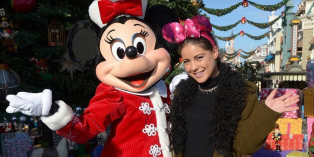Louise Thompson joins Minnie Mouse to celebrate the Enchanted Christmas at Disneyland Paris, France, on Saturday Nov. 9, 2013. (Photo by Jon Furniss/Invision for Disneyland Paris/AP)