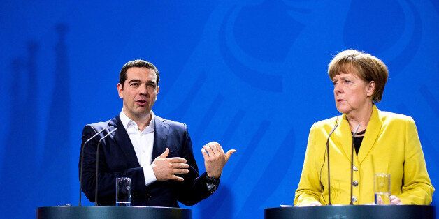 BERLIN, GERMANY - MARCH 23: German Chancellor Angela Merkel and Greek Prime Minister Alexis Tsipras speak to the media following talks at the Chancellery on March 23, 2015 in Berlin, Germany. The two leaders are meeting as relations between the Tsipras government and Germany have soured amidst contrary views between the two countries on how Greece can best work itself out of its current economic morass. (Photo by Carsten Koall/Getty Images)