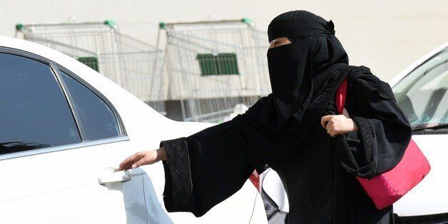 A Saudi woman gets into a taxi at a mall in Riyadh as a grassroots campaign planned to call for an end to the driving ban for women in Saudi Arabia on October 26, 2014. Amnesty International is calling on the Saudi Arabian authorities to respect the right of women to defy the ban by driving this weekend and to end the harassment of supporters of the campaign. AFP PHOTO/FAYEZ NURELDINE (Photo credit should read FAYEZ NURELDINE/AFP/Getty Images)