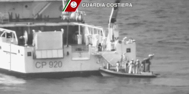 In this image taken from video made available by Guardia Costiera, an Italian coast Guard vessel during ongoing search and rescue operation in the Mediterranean Sea south of the Italian island of Lampedusa, Sunday April 19, 2015, to locate migrants who are believed to be lost at sea. UNHCR says Sunday, the search and recovery rescue operation is under way after a boat carrying migrants is believed to have overturned north of Libya, with some 600 people still missing. (Guardia Costiera via AP)