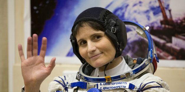 Italian astronaut Samantha Cristoforetti, crew member of the mission to the International Space Station, ISS, waves prior to the launch of Soyuz-FG rocket at the Russian leased Baikonur cosmodrome, Kazakhstan, Sunday, Nov. 23, 2014. (AP Photo/Dmitry Lovetsky)