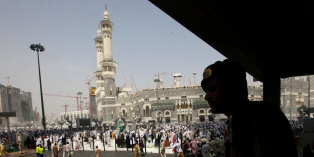 A Saudi policeman watches an area near the Grand Mosque in the Muslim holy city of Mecca, Saudi Arabia, Thursday, Oct. 10, 2013. Every Muslim is required to perform the hajj, or pilgrimage, to Mecca at least once in his or her lifetime if able to do so. (AP Photo/Amr Nabil)