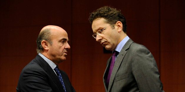 Spanish Economy Minister Luis de Guindos Jurados (L) speaks with Dutch Finance Minister and president of the Eurogroup Jeroen Dijsselbloem prior to a Eurogroup finance ministers meeting at the EU Headquarters in Brussels on December, 9 2013. AFP PHOTO/JOHN THYS (Photo credit should read JOHN THYS/AFP/Getty Images)