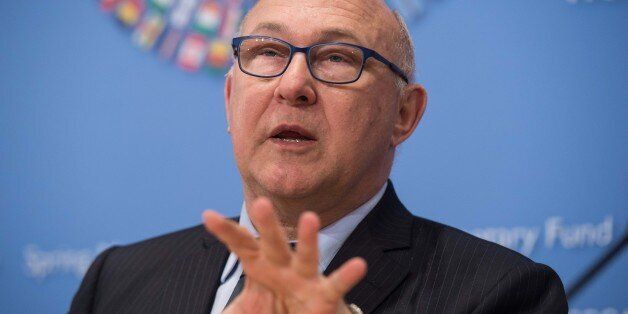 French Finance Minister Michel Sapin speaks at a press conference at the end of IMF/WB Spring Meetings in Washington, DC, on April 18, 2015. AFP PHOTO/NICHOLAS KAMM (Photo credit should read NICHOLAS KAMM/AFP/Getty Images)