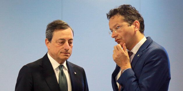 Eurogroup president Jeroen Dijsselbloem, right, and President of the ECB, Mario Draghi talk during the Informal Meeting of Ministers for Economic and Financial Affairs of the European Union in Riga, Latvia on Friday, April 24, 2015. Greece's finance minister came under fire Friday from his peers in the 19-country eurozone for failing to come up with a comprehensive list of economic reforms that are needed if the country is to get vital loans to avoid going bankrupt. (Dmitris Sulzics/F64 Photo Agency via AP)