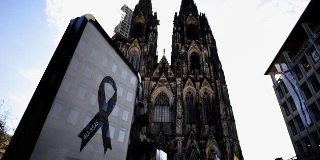 COLOGNE, GERMANY - APRIL 17: A black ribbon showing the flight number of Germanwings flight 4U9525 is displayed at the Dom cathedral, ahead of a memorial service to commemorate the victims of the Germanwings passenger plane crash, on April 17, 2015 in Cologne, Germany. Approximately 1,400 people, including 500 family member of victims, will attend the service to pay their respects to the 149 victims killed when co-pilot Andreas Lubitz purposefully locked himself in the cockpit and piloted the plane at high speed into a mountainside in southern France on March 24, instantly killing everyone on board, including himself. (Photo by Sascha Schuermann/Getty Images)
