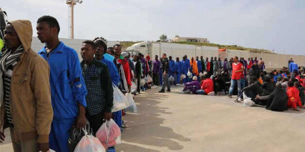 Migrants board on a cruise ship as they leave the Island of Lampedusa, Southern Italy, to be transferred in Porto Empedocle, Sicily, Friday, April 17, 2015. An unprecedented wave of migrants has headed for the European Union's promised shores over the past week, with 10,000 people making the trip. Hundreds â nobody knows how many â have disappeared into the warming waters of the Mediterranean, including 41 migrants reported dead Thursday after a shipwreck. (AP Photo/Francesco Malavolta)