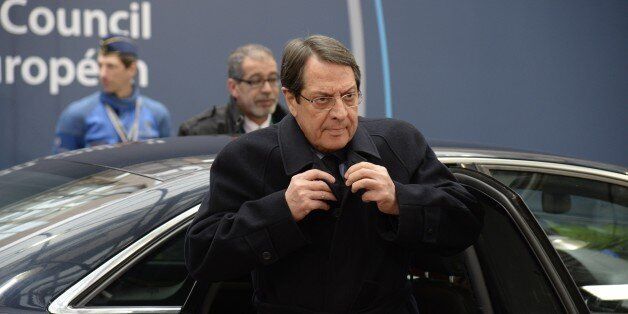 President of Cyprus Nicos Anastasiades arrives for a European Union summit in Brussels on March 20, 2015. EU foreign affairs head Federica Mogherini will hold talks with British, French and German leaders to discuss ongoing negotiations on Iran's contested nuclear programme, her office said. AFP PHOTO / THIERRY CHARLIER (Photo credit should read THIERRY CHARLIER/AFP/Getty Images)