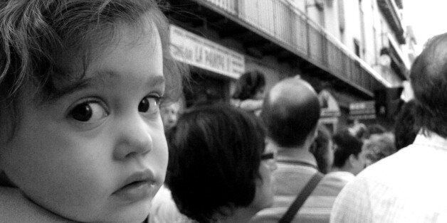 During " Virgen de la Capilla's day" in JaÃ©n, many people in the streets, this child was close to me, I' ve been lucky that I could take her a photo.