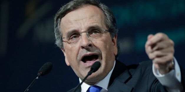 Greece's Prime Minister Antonis Samaras delivers his final campaign speech at the Taekwondo Indoor Stadium in southern Athens on Friday, Jan. 23, 2015. All opinion polls on Sunday's closely-watched national election agree: The radical left opposition Syriza party, which has vowed to rewrite the terms of Greece's international bailout, enjoys a lead of at least 4 percentage points over Prime Minister Antonis Samaras' conservatives. (AP Photo/Lefteris Pitarakis)