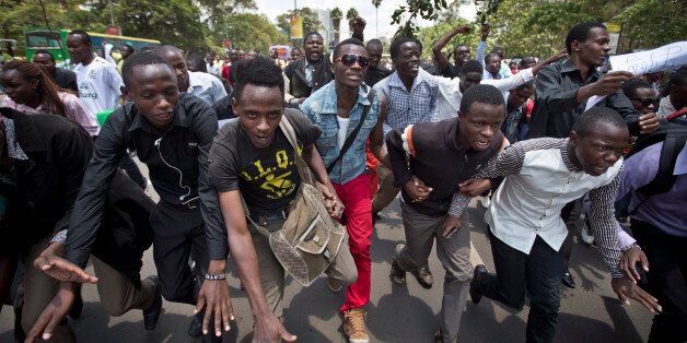 Kenyan students march in memory of the victims of the Garissa college attack and to protest what they say is a lack of security, in downtown Nairobi, Kenya Tuesday, April 7, 2015. Hundreds of Kenyan students marched through downtown Nairobi on Tuesday to honor those who died in the attack on a college by Islamic militants and to press the government for better security in the wake of the slaughter. (AP Photo/Ben Curtis)