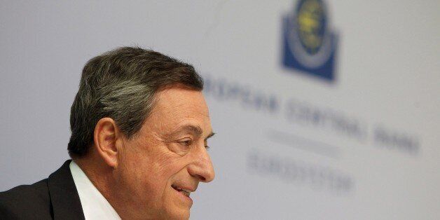 Mario Draghi, President of the European Central Bank (ECB) addresses the media during a press conference following the meeting of the Governing Council in Frankfurt/Main, Germany, on April 15, 2015. A news conference by European Central Bank president Mario Draghi in the bank's headquarters was briefly interrupted Wednesday when a young woman charged at Draghi calling for an 'end to the ECB dictatorship'. AFP PHOTO / DANIEL ROLAND (Photo credit should read DANIEL ROLAND/AFP/Getty Images)