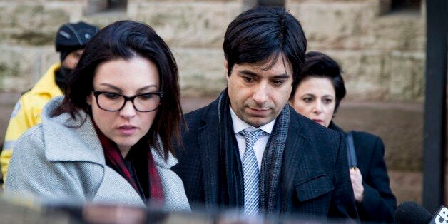 TORONTO, ON - FEBRUARY 11: Jian Ghomeshi (middle) leaves with co counsel Danielle Robitaille (left) and lawyer Marie Henein.Jian Ghomeshi exits the courthouse after his trial arguments ended. The verdict is to come March 24. (Carlos Osorio/Toronto Star via Getty Images)