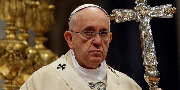 Pope Francis holds the pastoral staff as he celebrates an Armenian-Rite Mass to commemorate the 100th anniversary of the Armenian Genocide, in St. Peter's Basilica, at the Vatican Sunday, April 12, 2015. Historians estimate that up to 1.5 million Armenians were killed by Ottoman Turks around the time of World War I, an event widely viewed by genocide scholars as the first genocide of the 20th century. Turkey however denies that the deaths constituted genocide, saying the toll has been inflated,