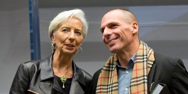 Managing Director of the International Monetary Fund Christine Lagarde, left, shakes hands with Greek Finance Minister Yanis Varoufakis during a meeting of eurogroup finance ministers in Brussels on Wednesday, Feb. 11, 2015. Leading European officials downplayed expectations that a comprehensive debt deal with Greece is likely Wednesday at an emergency meeting in which Greeceâs finance minister is set to unveil a plan to loosen austerityâs grip on his economy. (AP Photo/Virginia Mayo)
