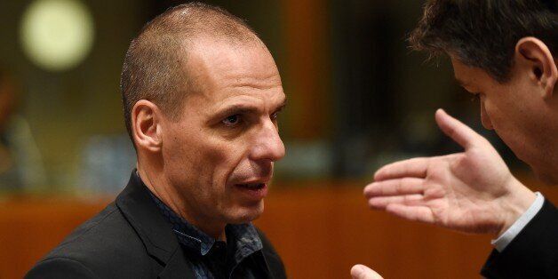 Greece's Finance Minister Yanis Varoufakis (L) speaks with Croatia's Finance Minister Boris Lalovac during an economic and financial affairs council (ECOFIN) at the European Council in Brussels, March 10, 2015. AFP PHOTO / EMMANUEL DUNAND (Photo credit should read EMMANUEL DUNAND/AFP/Getty Images)
