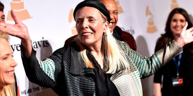 In this Feb.7, 2015 file photo, Joni Mitchell arrives at the 2015 Clive Davis Pre-Grammy Gala at the Beverly Hilton Hotel in Beverly Hills, Calif. Mitchell was hospitalized in Los Angeles on Tuesday, March 31, 2015 according to the Twitter account and website of the folk singer and Rock and Roll Hall of Famer, but details on her condition have not been released. (Photo by John Shearer/Invision/AP, File)