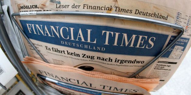 An edition of the Financial Times Deutschland is seen at a newspaper and tobacco shop in Frankfurt, Germany, Friday, Nov. 23, 2012. The publisher of the Financial Times' German offshoot says production will be stopped shortly and some 320 employees will lose their jobs. The Financial Times Deutschland, which has a circulation of about 100,000, was launched at the height of the Internet boom in 2000 but was never profitable. Hamburg-based publisher Gruner + Jahr said in a statement Friday it sees