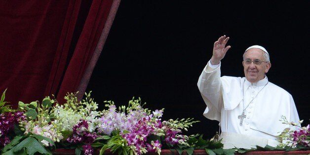 Pope Francis greets the crowd from the central loggia of St Peters' basilica after the 'Urbi et Orbi' blessing for Rome and the world following the Easter Mass on April 5, 2015 in Vatican. Pope Francis condemned, yesterday, indifference and 'complicit silence' to jihadist attacks on Christians as he presided over Easter ceremonies in the wake of a massacre of nearly 150 people at a Kenyan university by Shebab Islamists. The leader of the world's 1.2 billion Catholics brought up the extremist per