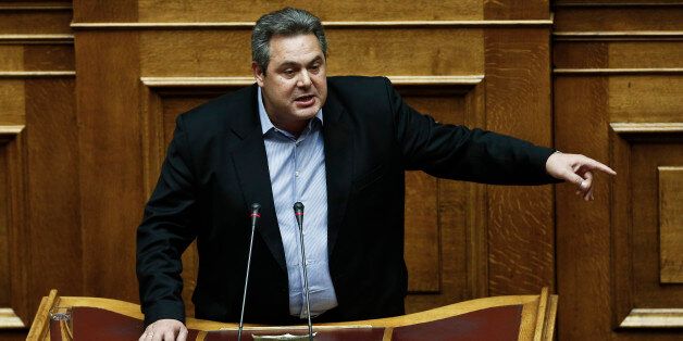 Greek Defense Minister Panos Kammenos speaks during a parliament session before a vote of confidence in Athens, Tuesday, Feb. 10, 2015. Greece's newly elected government was due to receive a vote of confidence from the newly-elected parliament late Tuesday, and his ministers insisted they would stick to their election pledges â halting major privatization plans and reversing austerity taxes demanded by bailout lenders.(AP Photo/Petros Giannakouris)