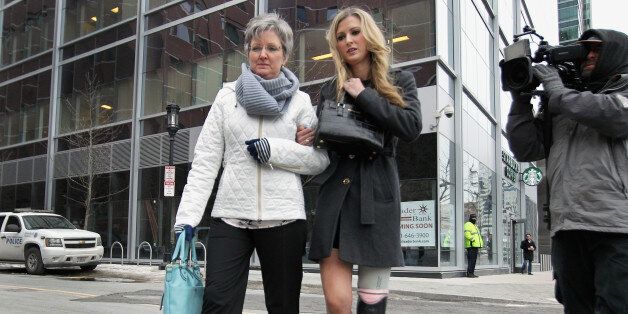 BOSTON - MARCH 5: Boston Marathon bombing victim, Rebekah Gregory, right, arrived at Moakley Federal Courthouse in Boston, where the second day in the trial of Dzhokhar Tsarnaev got underway on March 5, 2015. (Photo by Wendy Maeda/The Boston Globe via Getty Images)