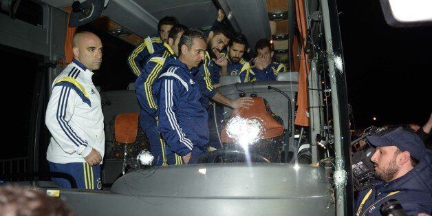 TRABZON, TURKEY - APRIL 04: Turkish soccer team Fenerbahce's team bus, damaged with foreign objects by unidentified attackers, is seen in Surmene District of Trabzon, Turkey on April 04, 2015 as they return back from soccer match played with Caykur Rizespor in Rize. (Photo by Hakan Burak Altunoz/Anadolu Agency/Getty Images)