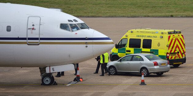 An ambulance waits to transfer 14-year-old Malala Yousafzai, the Pakistani girl shot in the head by Taliban gunmen for campaigning for the right to an education, upon her arrival aboard a plane at Birmingham Airport in Birmingham, central England on October 15, 2012. Yousafzai will be cared for at the Queen Elizabeth Hospital in Birmingham, a highly specialised facility where British soldiers seriously wounded in Afghanistan are treated, a spokeswoman for Prime Minister David Cameron said. AFP P