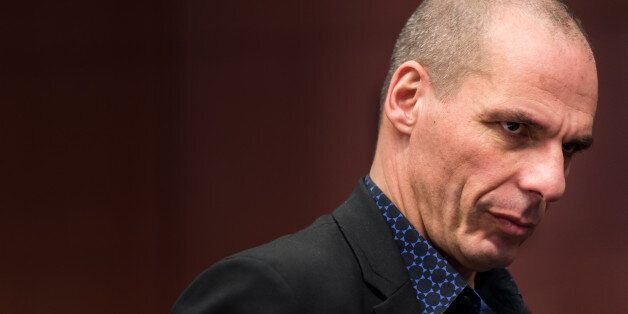 Greek Finance Minister Yanis Varoufakis arrives for a meeting of eurogroup finance ministers at the European Council building in Brussels, Monday March 9, 2015. (AP Photo/Geert Vanden Wijngaert)