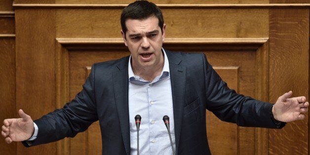 Greek Prime Minister Alexis Tsipras addresses a parliament session in Athens on March 30, 2015. The EU warned on March 30 that Greece and its creditors had yet to hammer out a new list of reforms despite talks lasting all weekend aimed at staving off bankruptcy and a euro exit. AFP PHOTO / ARIS MESSINIS (Photo credit should read ARIS MESSINIS/AFP/Getty Images)