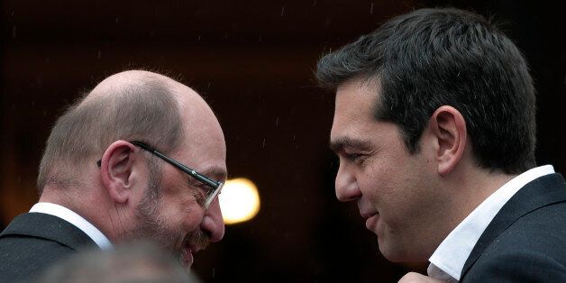 Greek Prime Minister Alexis Tsipras, right, greets European Parliament President Martin Schulz, left,...
