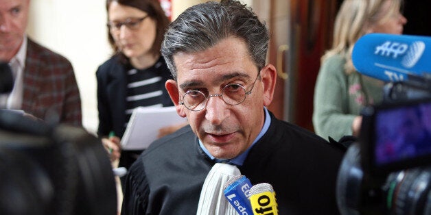 French lawyer Jean-Marc Fedida addresses reporters at the Paris court house, Monday April 13, 2015, after his client, the heiress of the fashion and perfume house Nina Ricci has been sentenced to a year in prison and ordered to pay heavy fines and back taxes for having hidden millions of euros in HSBC bank accounts in Switzerland. A Paris court convicted Arlette Ricci, 73, granddaughter of designer Nina Ricci, of tax evasion and money laundering. (AP Photo/Remy de la Mauviniere)