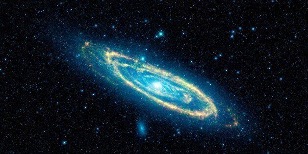 This image provided by NASA shows the immense Andromeda galaxy, also known as Messier 31, captured in full in this new image from NASA's Wide-field Infrared Survey Explorer, or WISE. NASA on Wednesday Feb. 17, 2010 released the first images from the instrument which spots celestial objects that give off infrared light. Andromeda is the closest large galaxy to our Milky Way galaxy, and is located 2.5 million light-years from our sun. (AP Photo/NASA)