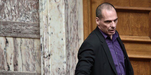 Greek Finance Minister Yanis Varoufakis arrrives on March 18, 2015 at the parliament in Athens. Greece was responding sharply to apparent pressure from the EU not to pass a so-called 'humanitarian crisis' law that would provide free electricity and food stamps for the poorest households. AFP PHOTO / ARIS MESSINIS (Photo credit should read ARIS MESSINIS/AFP/Getty Images)