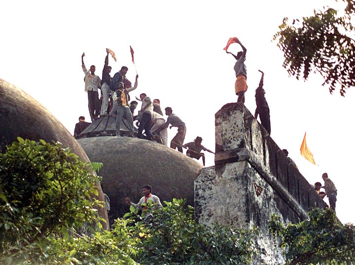 Kar sevaks on top of the Babri Masjid on 6 December 1992, hours before the mosque was demolished.