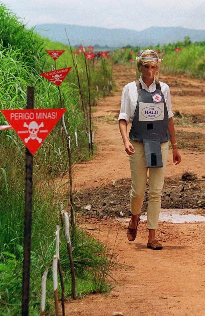 Princess Diana touring a minefield in body armour during her visit to Angola in 1997.