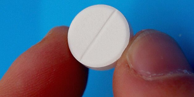 MELBOURNE, AUSTRALIA - JULY 24: A paracetamol tablet is held on July 24, 2014 in Melbourne, Australia. In a new study published in the prestigious medical journal, 'The Lancet' the most common pain reliever for back pain, paracetamol, does not work any better than a placebo. (Photo by Scott Barbour/Getty Images)