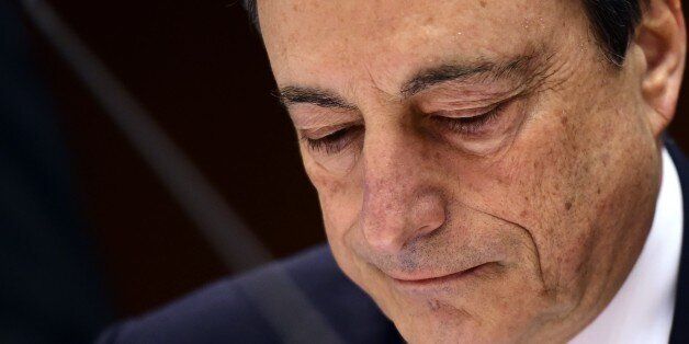 European Central Bank President Mario Draghi looks on before delivering introductory remarks in front of the Economic and Monetary Affairs Committee at the European Parliament, in Brussels, on March 23, 2015. AFP PHOTO / EMMANUEL DUNAND (Photo credit should read EMMANUEL DUNAND/AFP/Getty Images)