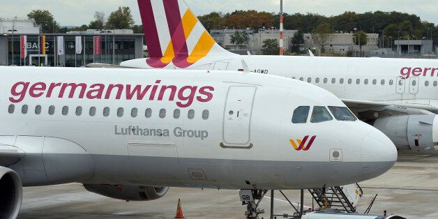 FILE - In this Oct. 16, 2014 an Airbus A 320 of the German airline Germanwings is parked at the airport in Cologne, Germany, as their pilots went on strike. French President Francois Hollande said no survivors are likely in the Alpine crash of a passenger jet carrying 148 people. The Germanwings passenger jet crashed Tuesday, March 24, 2015 in the French Alps region as it traveled from Barcelona to Duesseldorf, French officials. (AP Photo/Martin Meissner)