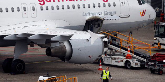 FILE - In this Oct. 16, 2014 file photo an Airbus 320 of Germanwings is parked at the airport as their pilots went on strike in Duesseldorf, Germany. A Germanwings Airbus plane with at least 142 passengers, two pilots and four flight attendants on board has crashed in the Alps region Tuesday, March 24, 2015. (AP Photo/Frank Augstein)