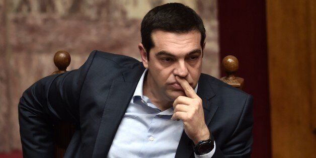 Greek Prime Minister Alexis Tsipras attends a parliament session in Athens on March 30, 2015. The EU warned Monday that Greece and its creditors had yet to hammer out a new list of reforms despite talks lasting all weekend aimed at staving off bankruptcy and a euro exit. AFP PHOTO / ARIS MESSINIS (Photo credit should read ARIS MESSINIS/AFP/Getty Images)