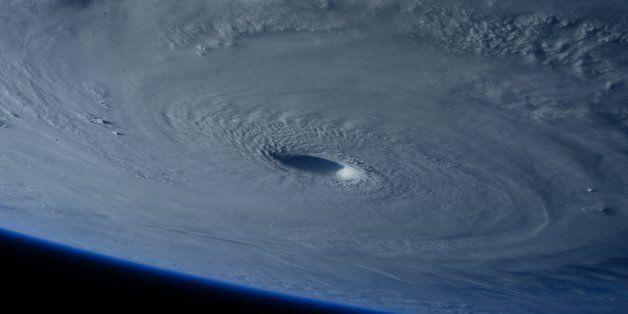 This image taken Tuesday March 31, 2015 shows Typhoon Maysak taken by astronaut Samantha Cristoforetti from the International Space Station. The Pacific Daily News newspaper in Guam reports the storm was upgraded Tuesday to a super typhoon with winds of 150 mph and was moving west-northwest at 15 mph. Officials say super Typhoon Maysak is expected to significantly weaken before reaching the Philippines around Sunday. (AP Photo/NASA, Samantha Cristoforetti) .