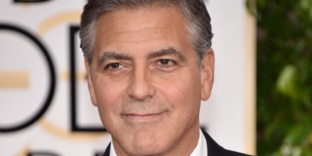 George Clooney wears a buttong reading