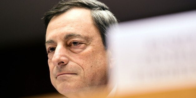 European Central Bank President Mario Draghi looks on before delivering introductory remarks in front of the Economic and Monetary Affairs Committee at the European Parliament, in Brussels, on March 23, 2015. AFP PHOTO / EMMANUEL DUNAND (Photo credit should read EMMANUEL DUNAND/AFP/Getty Images)