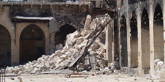 A picture taken on April 25, 2013 shows the rubble of the minaret of Aleppo's ancient Umayyad mosque, in the UNESCO-listed northern Syrian city, after it was blown up the previous day. The iconic mosque in Aleppo's labyrinthine Old City has been a key battleground since last July, with rebels seeking the ouster of Bashar al-Assad's regime laying siege twice but each time managing only to keep control for less than 48 hours. AFP PHOTO/JALAL AL-HALABI (Photo credit should read JALAL AL-HALA