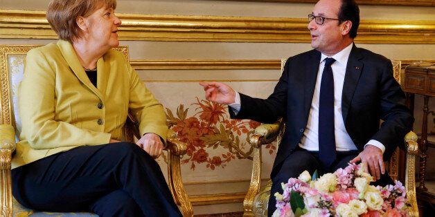 French President Francois Hollande, right, talks with German Chancellor Angela Merkel, at the Elysee Palace, in Paris, Friday, Feb. 20, 2015. Merkel is in Paris to discuss the crisis in eastern Ukraine and the economic stability of the eurozone. (AP Photo/Pascal Rossignol, Pool)