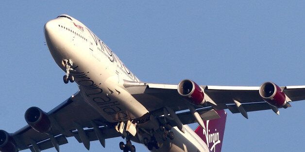 LONDON, ENGLAND - DECEMBER 29: A detailed view of the undercarriage of the Virgin Atlantic Boeing 747 as it passes overhead at Gatwick airport in West Sussex on December 29, 2014 in London, England. Flight VS43 was traveling to Las Vegas and returned to the airport due to a reported technical issue with one of the landing gears. (Photo by Jordan Mansfield/Getty Images)